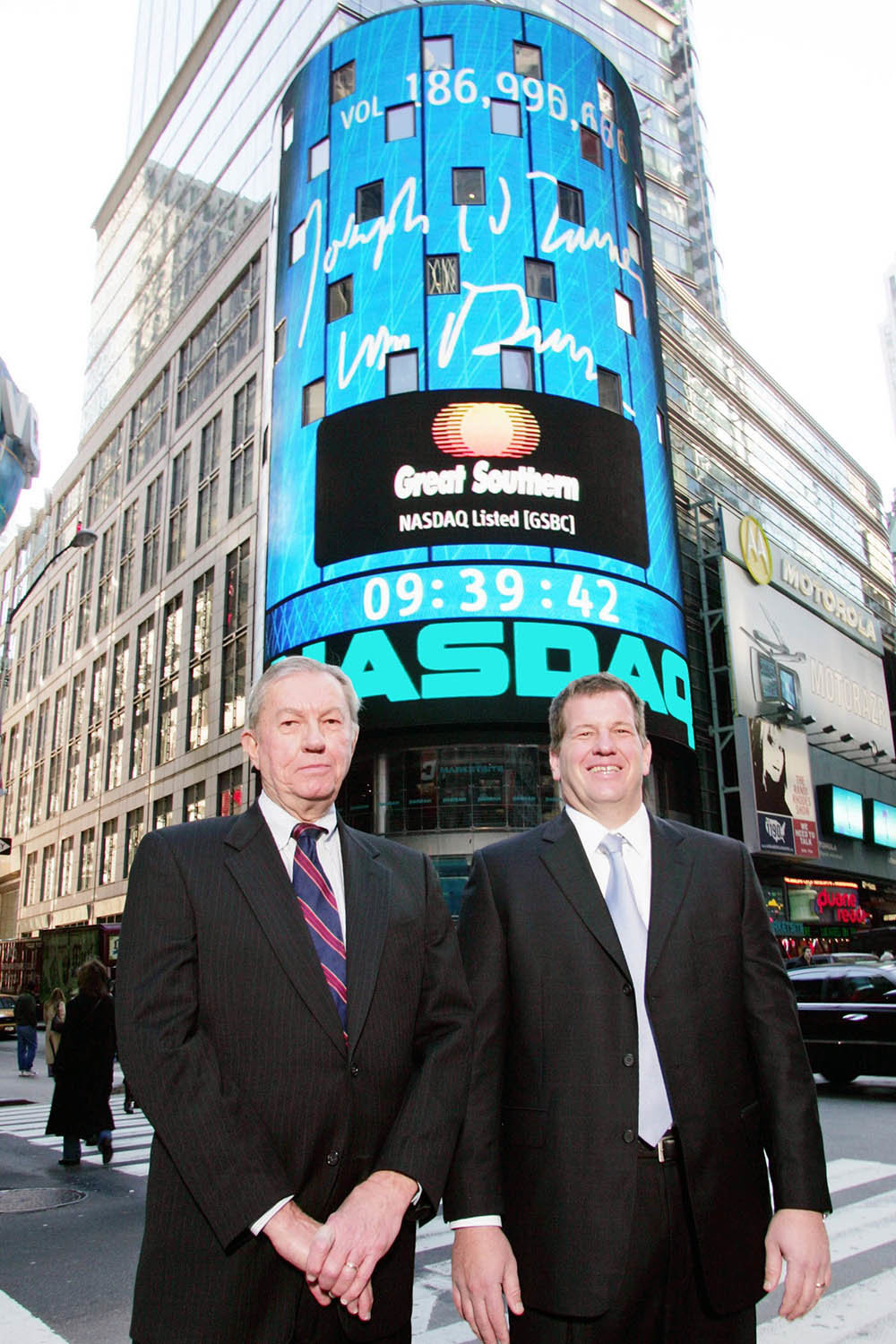 Bill Turner, left, and son Joe are in Times Square on Dec. 3, 2004, for Great Southern Bank’s opening of the Nasdaq stock market.